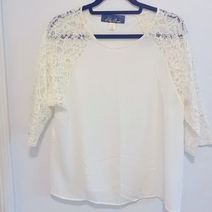Cream top with lace sleeves. Size small